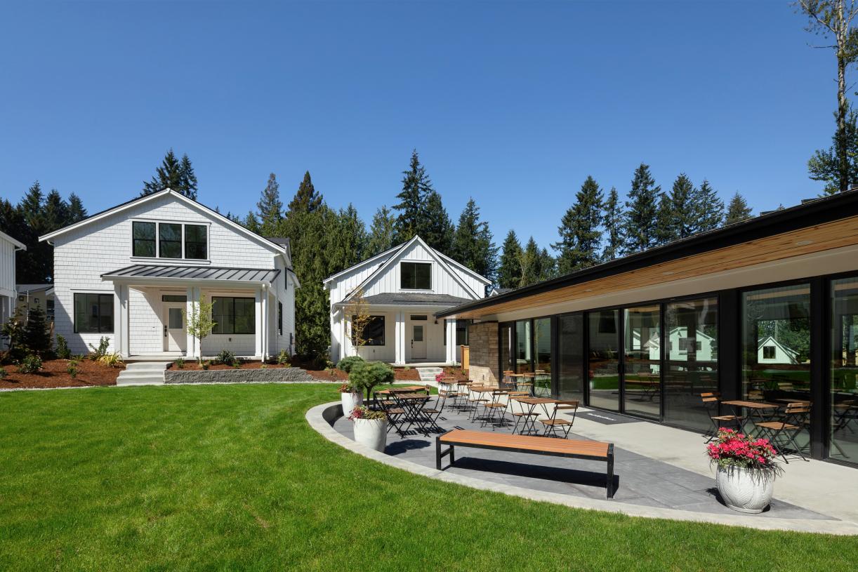 The private clubhouse with outdoor seating and lawn