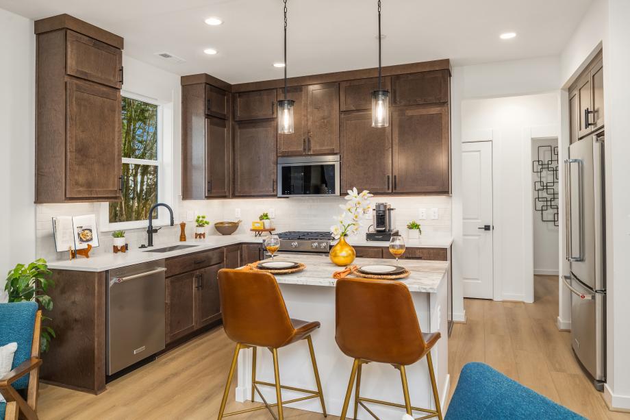 The kitchen features double-stacked cabinets for extra storage