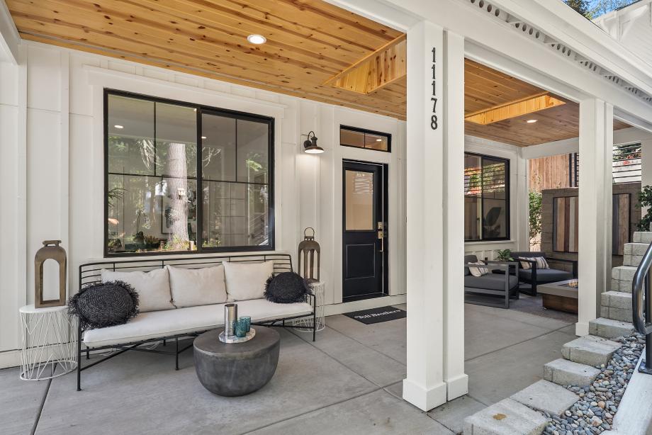 Covered patio offers 2 sitting areas