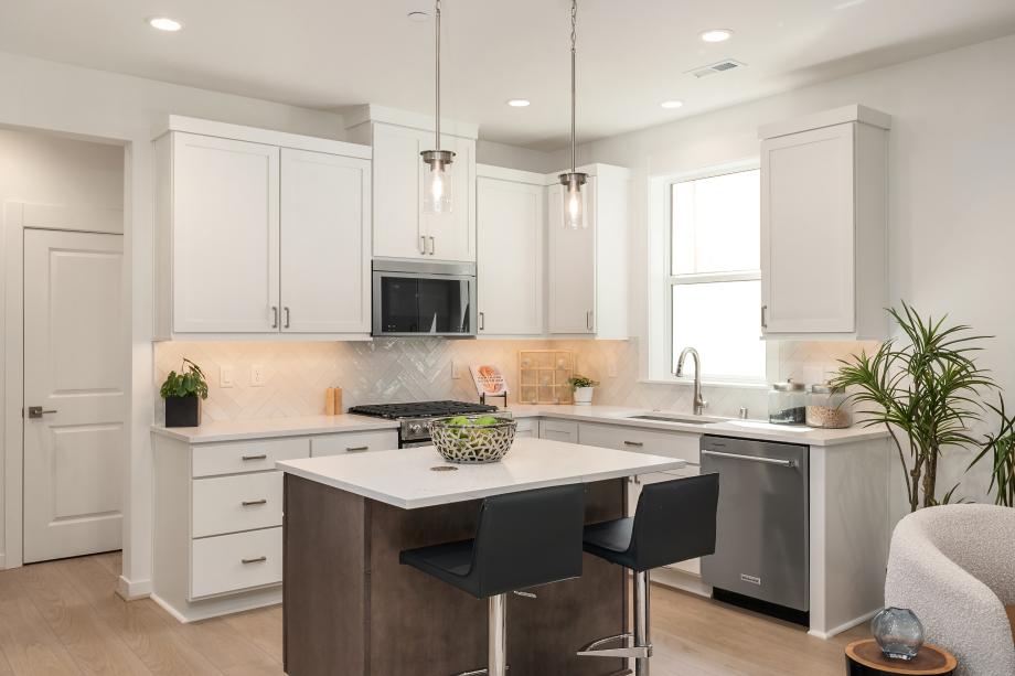 Kitchen features white shaker cabinets