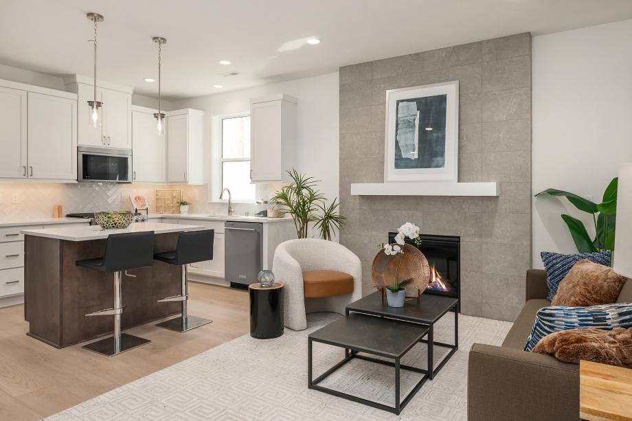 Gas fireplace with floor-to-ceiling tile is focal point of the great room