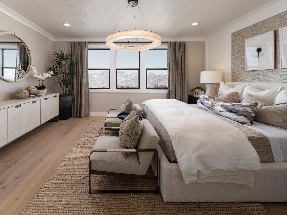 Primary suites with large windows and views of the surrounding mountains