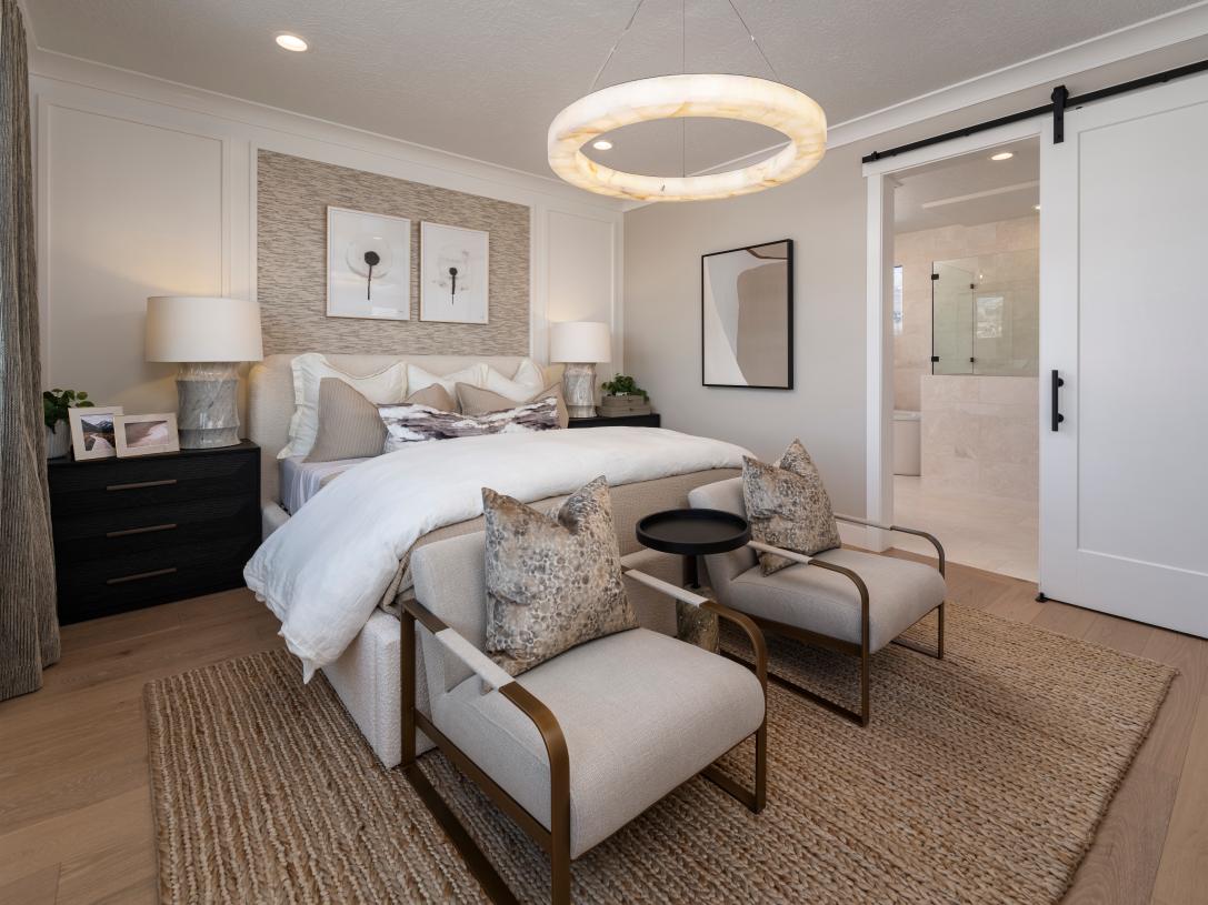 Primary suites with large windows and on-suite bathrooms