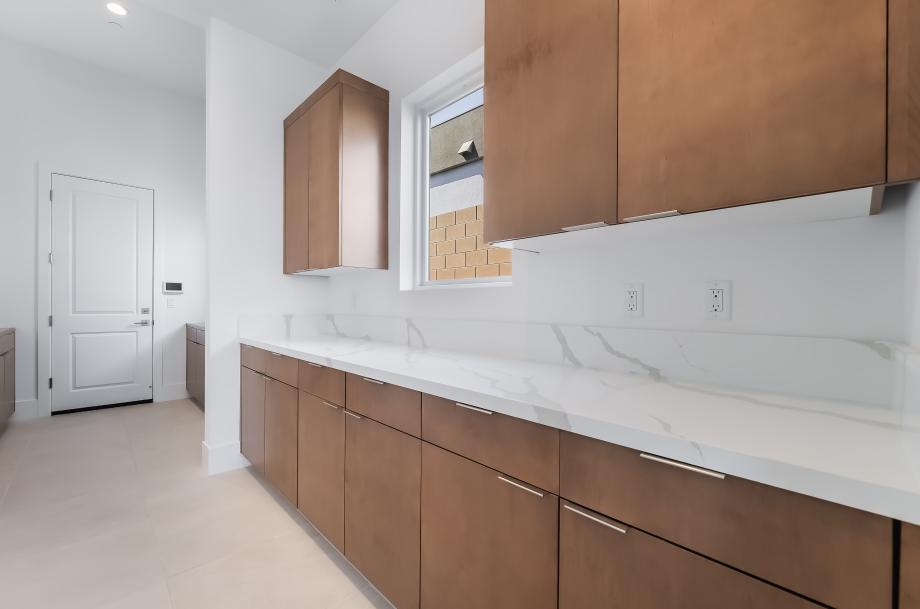 Convenient butler pantry with extra counter and storage space