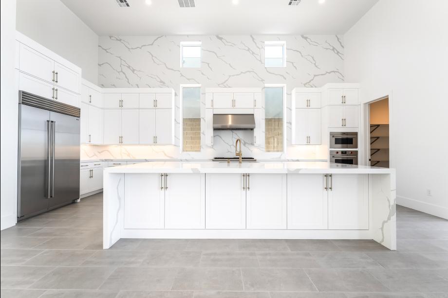 Stunning upgraded kitchen with white stacked cabinets