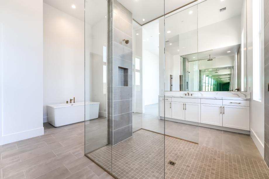 Beautiful primary bath with oversized shower and freestanding soaking tub