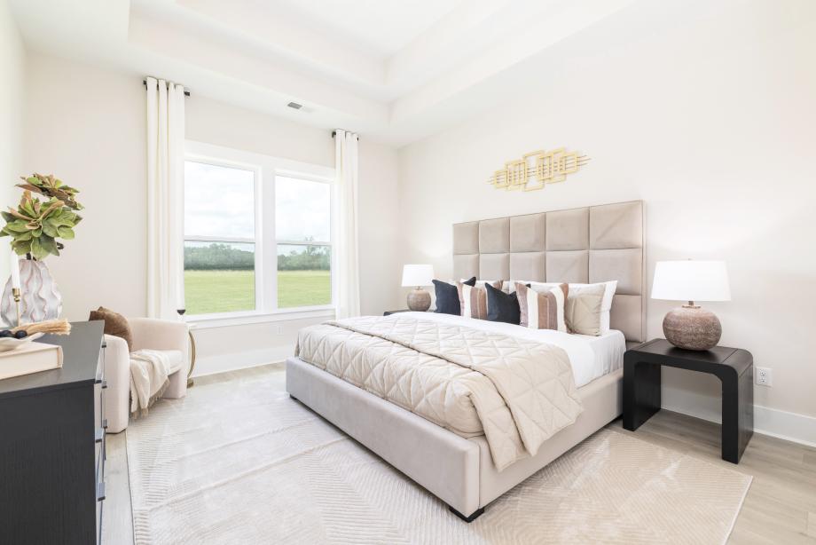 Luxurious first-floor primary bedroom