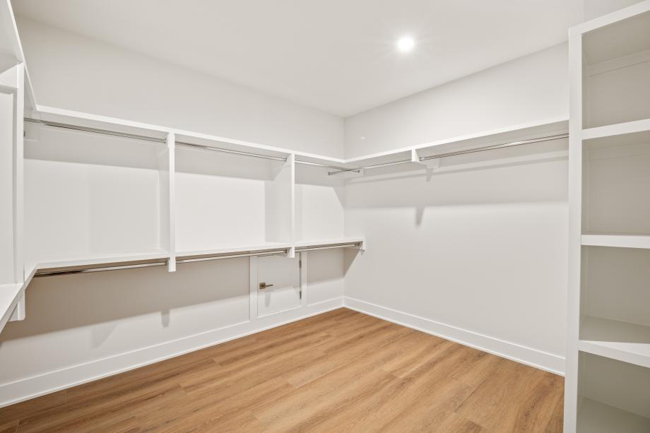 Primary closet includes built-in shelving