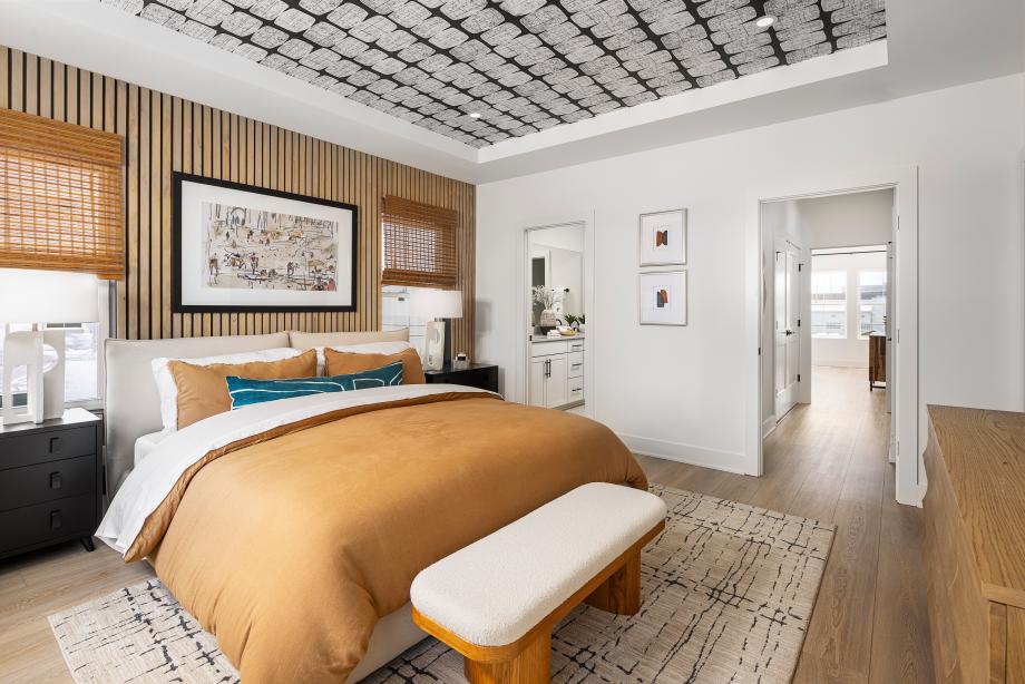 Primary bedroom suite features a large walk-in closet and lavish bath