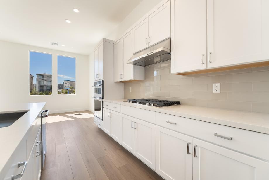 Upgraded kitchen hard surface and subway tile backsplash