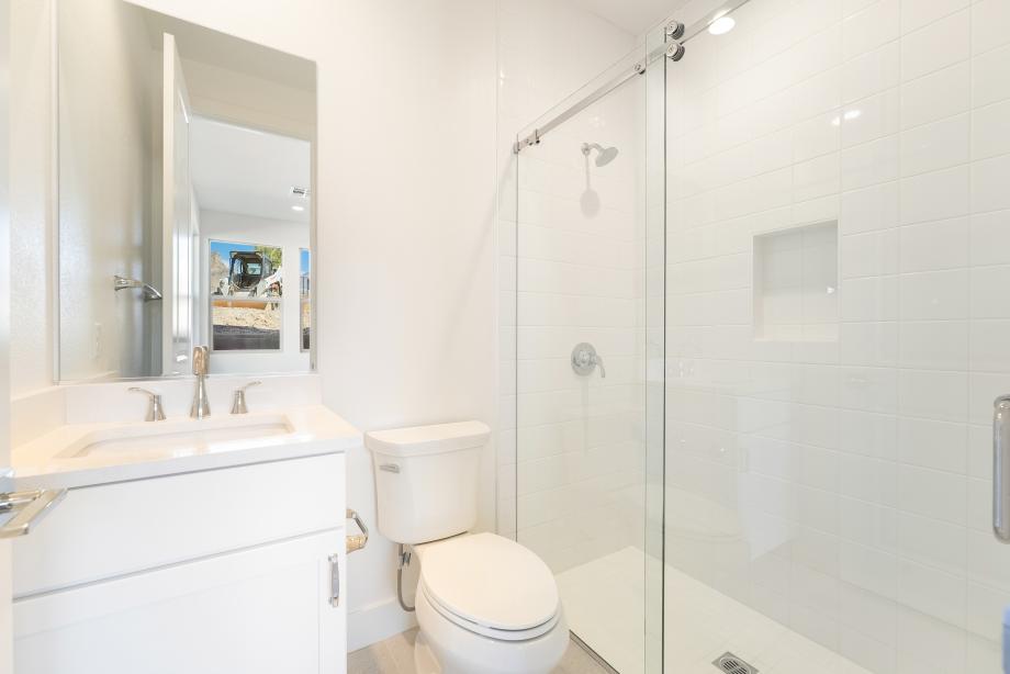 Full bath with tile surround shower on first floor