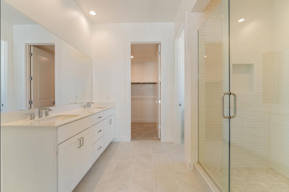 Luxe primary bath with tile surround shower