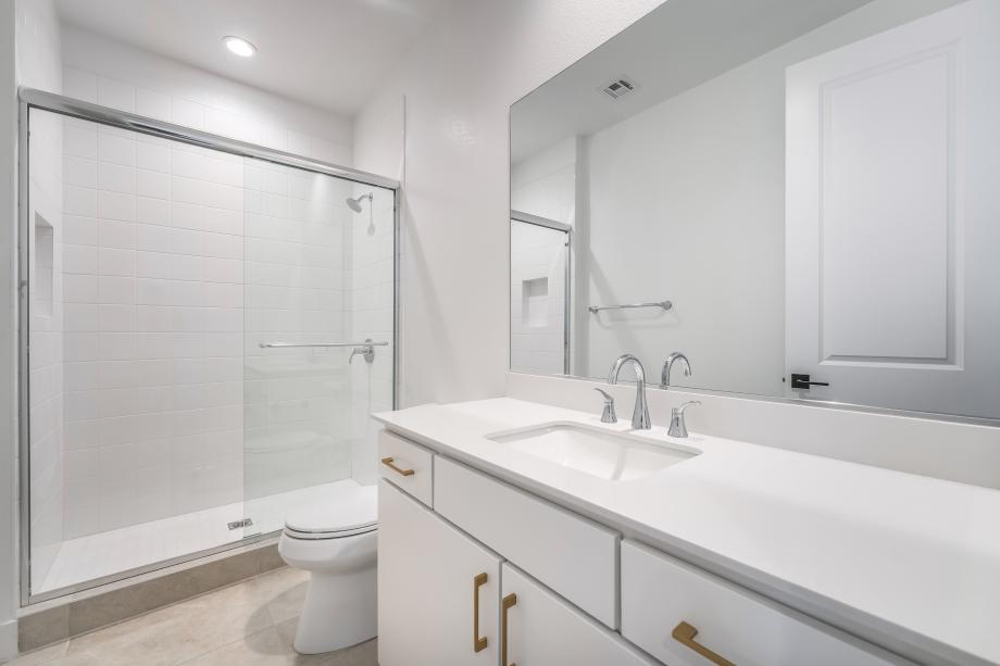 Full first-floor bath with tile surround shower