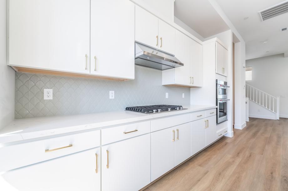 Upgraded kitchen hard surface and decorative tile backsplash