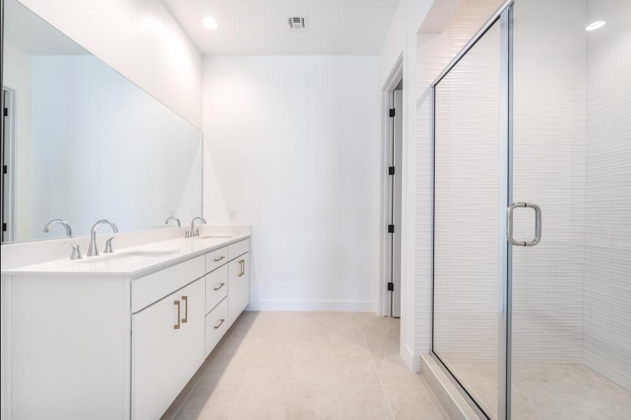 Luxe primary bath with tile surround shower