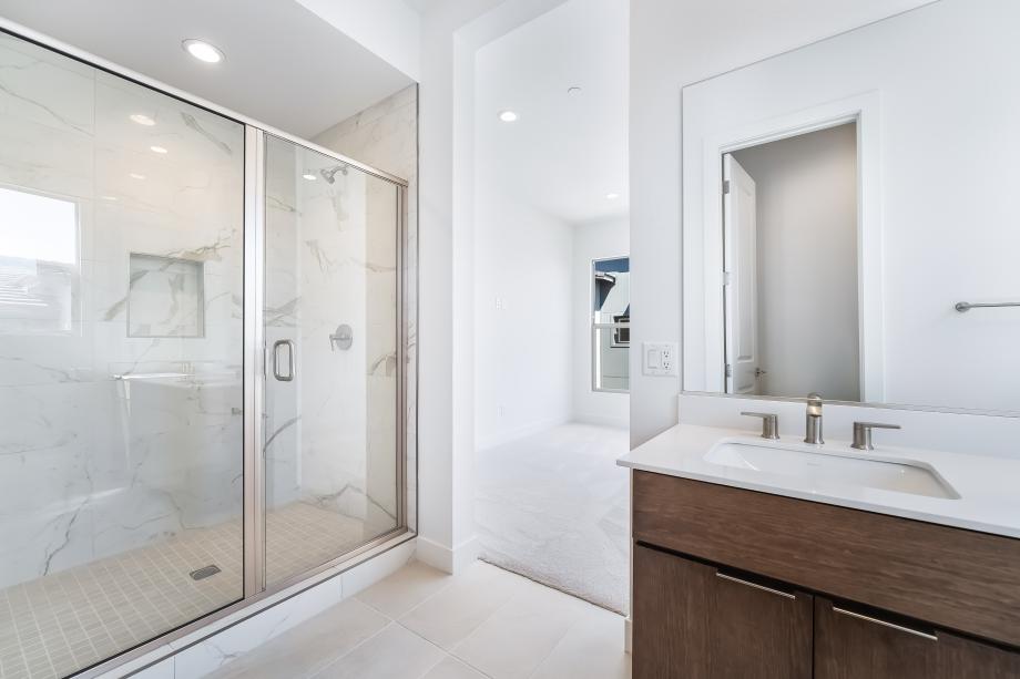 Luxe primary bath with tile surround shower
