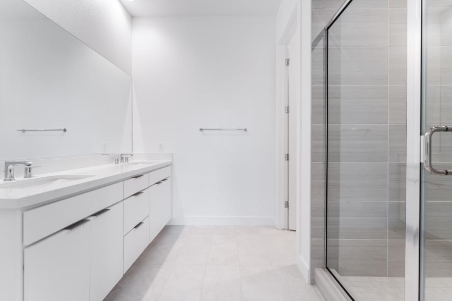 Upgraded primary shower with large tile surround