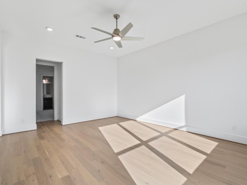Primary bedroom with hardwood floors
