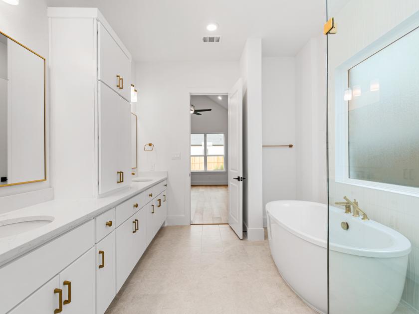 Primary bathroom with standalone tub and walk-in shower
