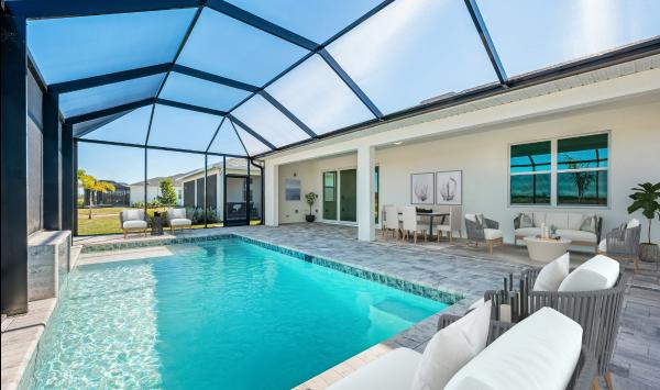 Enjoy the Florida sun in your spa-like pool with a spacious covered lanai
