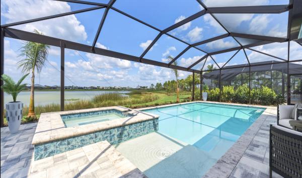 Enjoy beautiful lake views from your private pool with screened in lanai