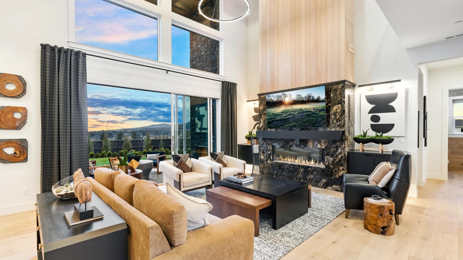 Stunning 2-story great room with stacked doors to covered patio