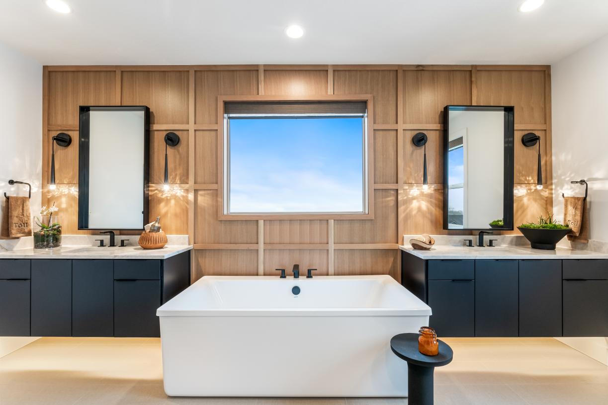 Luxe 5-piece bathroom with separate vanities and a free-standing tub