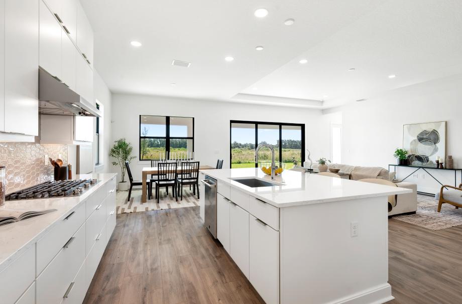 Great room, casual dining, and kitchen space filled with an abundance of natural light