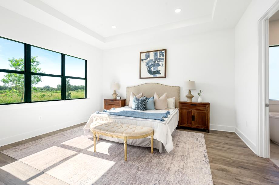 Spacious primary bedroom suite with a serene and private retreat feel