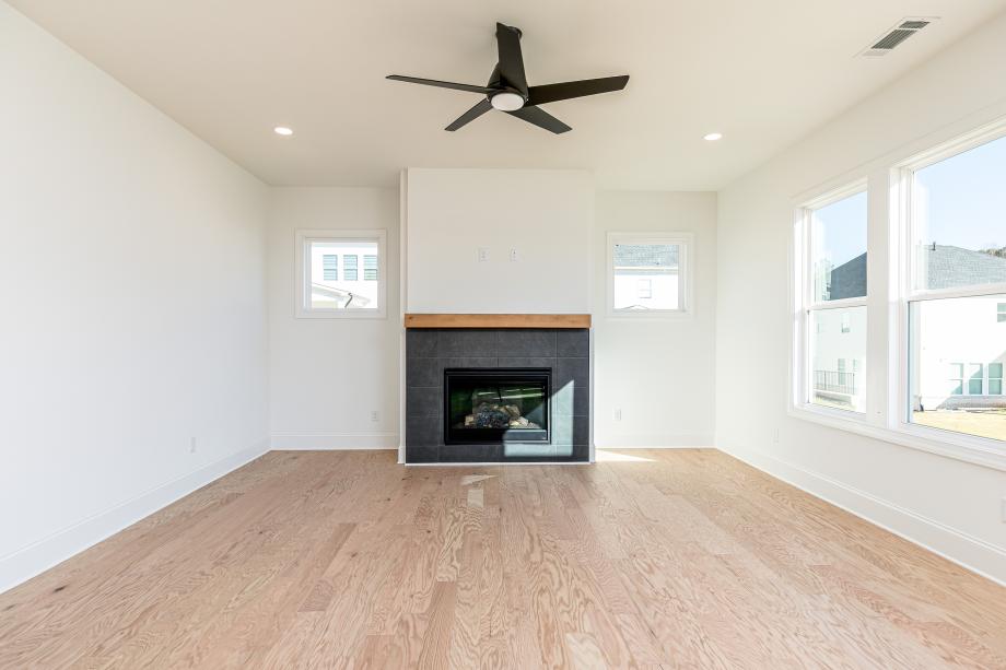 Lovely fireplace is the centerpiece of the great room