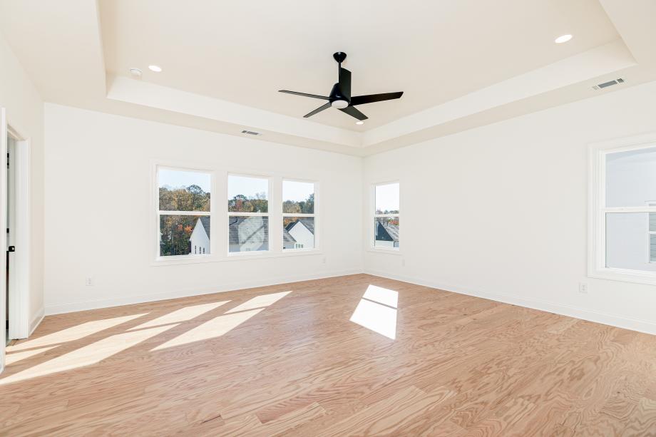 Sun-filled primary bedroom suite