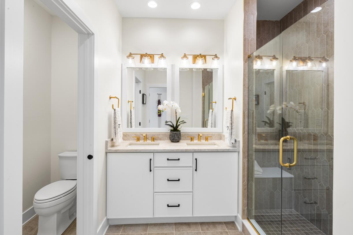 Spa-like primary baths with a dual sink and large shower