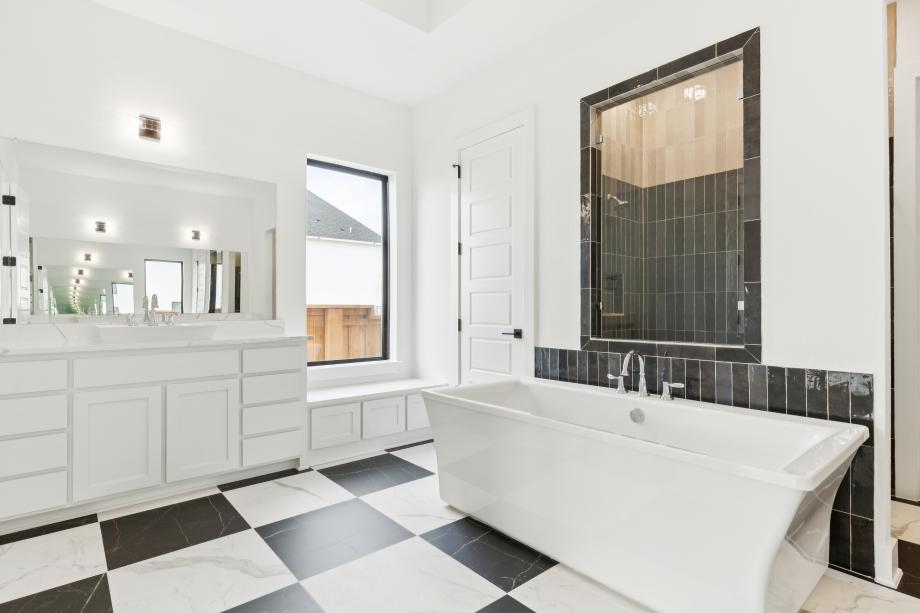 Luxurious primary bath with a large soaking tub