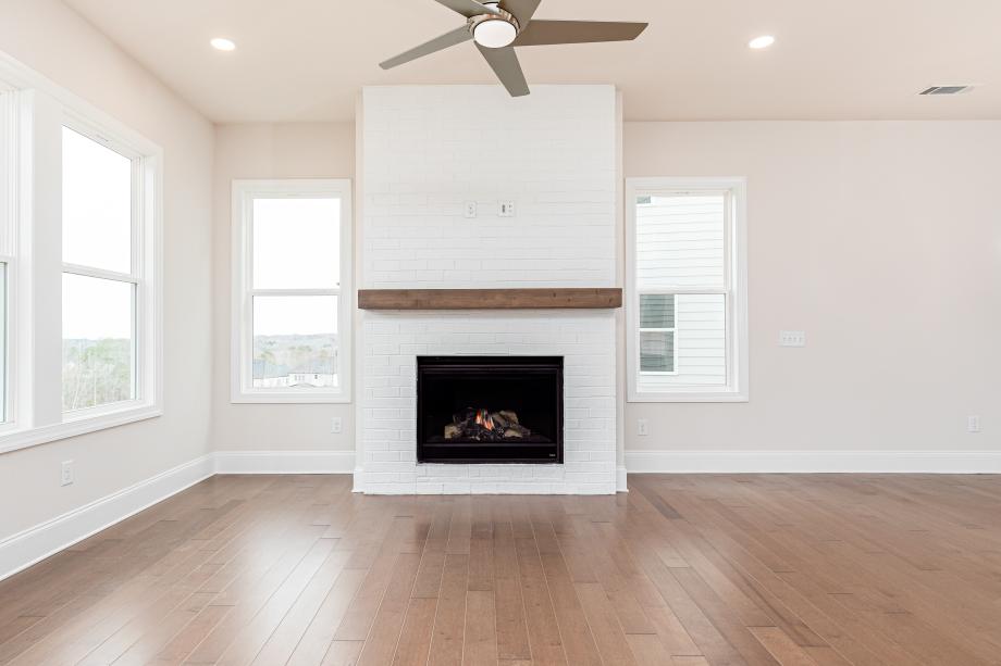 Cozy fireplace anchors the great room