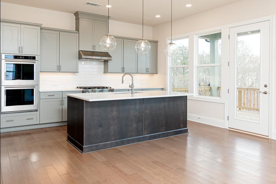 Chef-style kitchen that flows seamlessly to outdoor living space