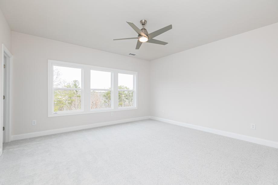 Expansive primary bedroom suite