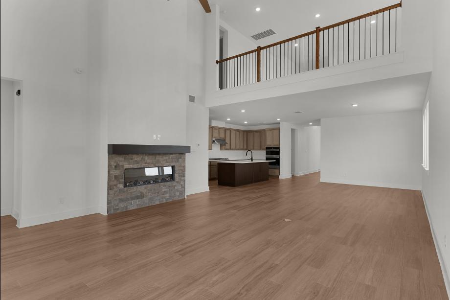 Open main living area with kitchen overlooking casual dining