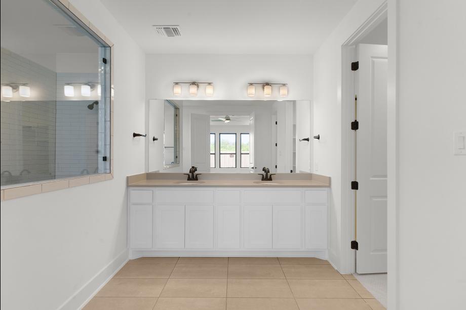 Dual-sink vanity and walk-in shower