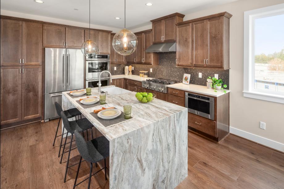 Upgrades in this home include a dolomite countertop on the island with a waterfall edge