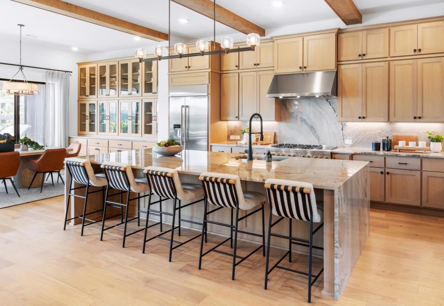 Oversized island with waterfall edges and updated cabinets