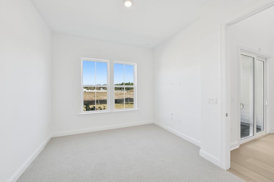 First-floor primary bedroom suite