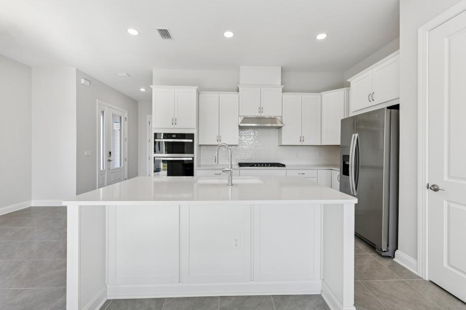 Well-equipped kitchen with beautiful cabinets and ample countertop space