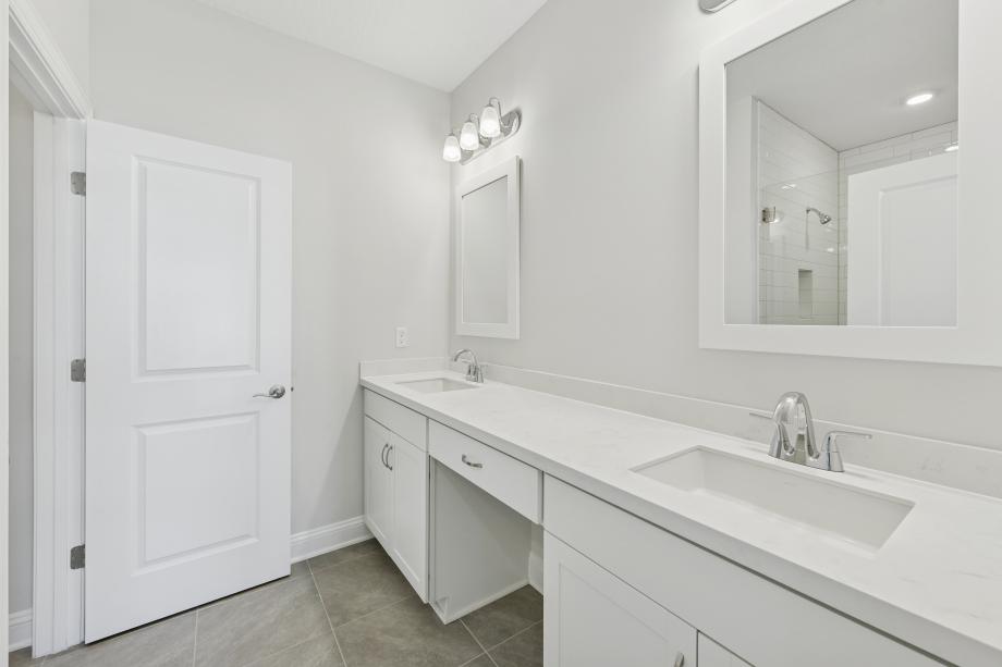 Primary bathroom with walk-in shower and large walk-in closet
