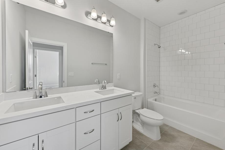 Secondary bathroom with a dual-sink vanity