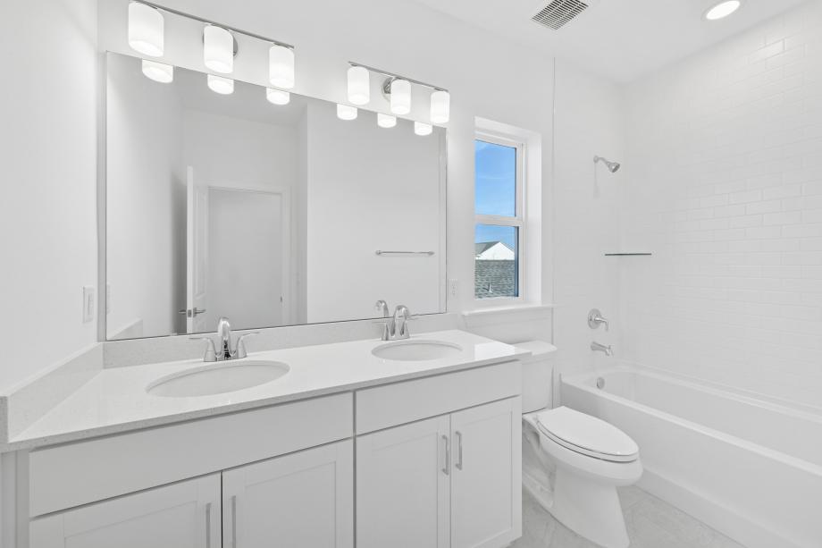 Beautiful secondary bathroom with a dual-sink vanity