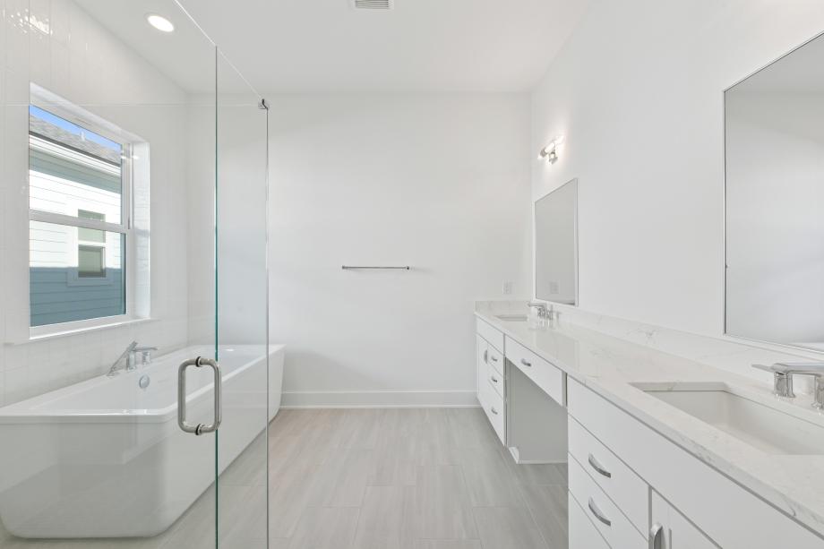 Large primary bathroom with a dual-sink vanity