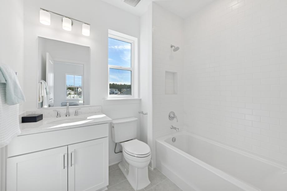 Secondary bathroom with dual-sink vanity
