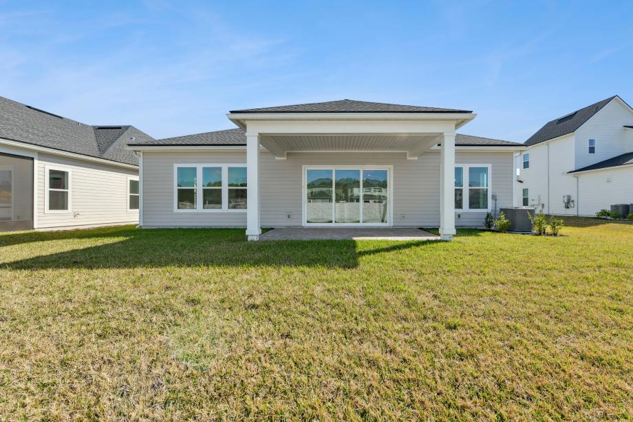 Covered lanai ideal for outdoor living, dining, and entertaining