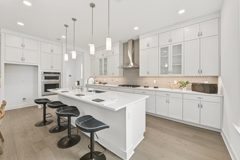 Well-equipped kitchen with white cabinets and ample countertop space