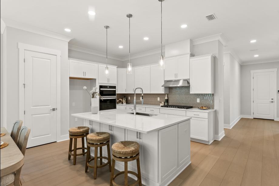 Well-appointed kitchen with large center island and ample cabinetry